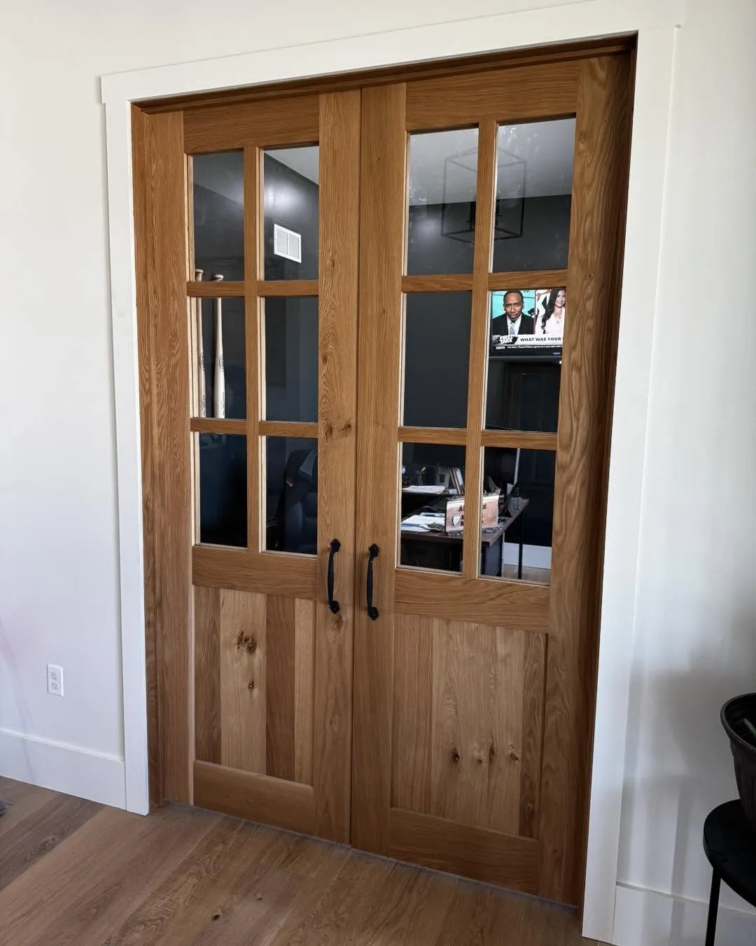 Custom oak French-style interior double doors with glass panels