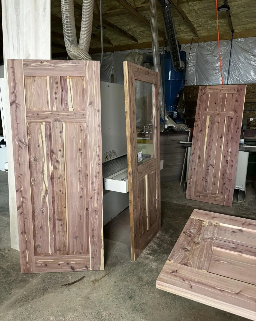 Cedar door panels in various stages of construction in our shop