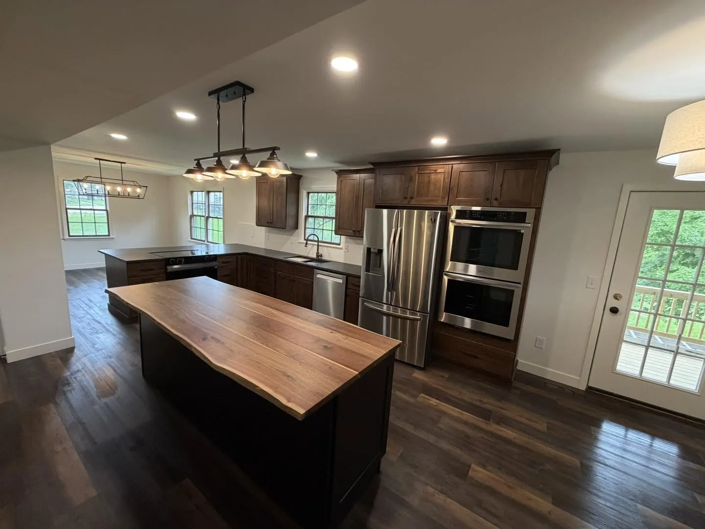 Open concept kitchen with live-edge walnut island top