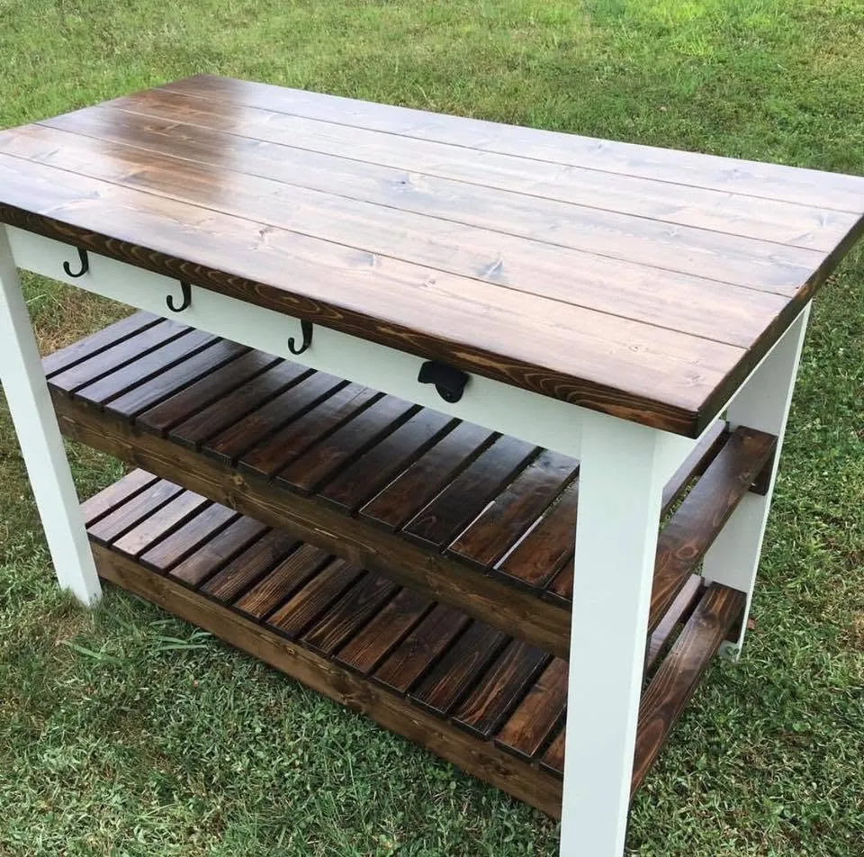 Farmhouse kitchen island cart with slatted shelves and towel hooks