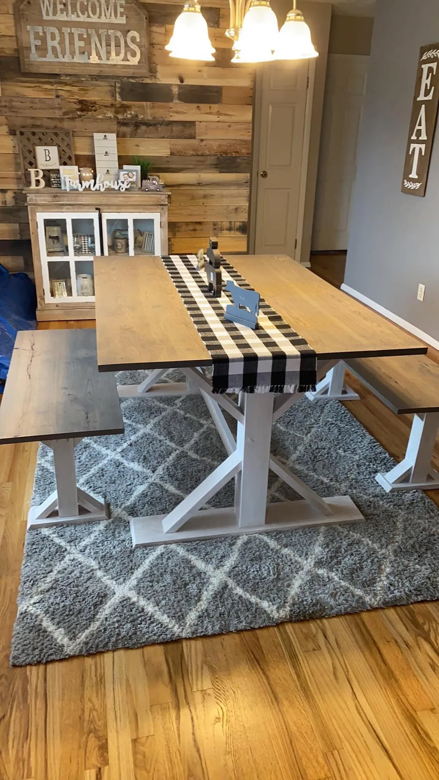 Whitewashed farmhouse trestle dining table with matching benches