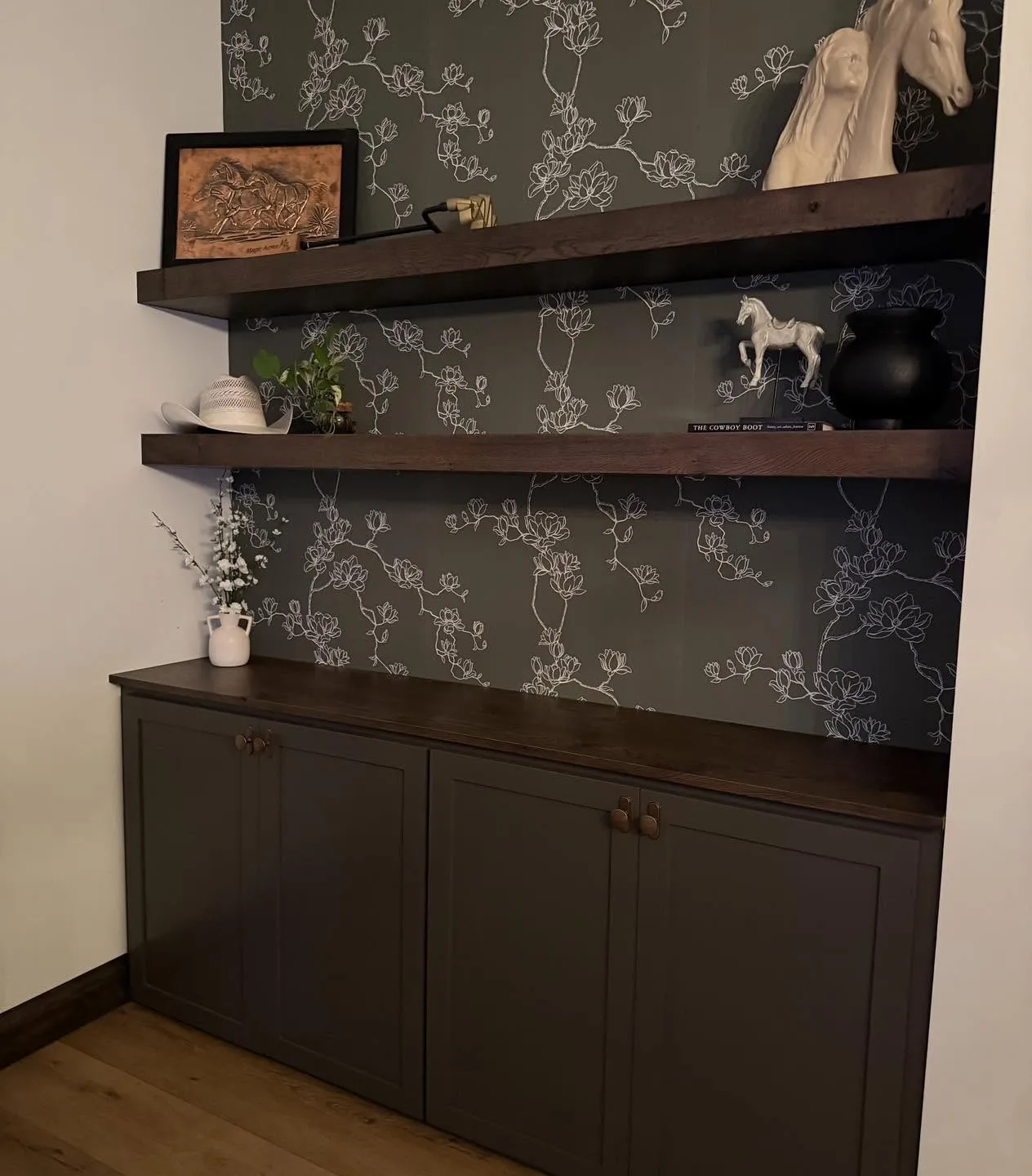 Walnut floating shelves and built-in cabinetry nook
