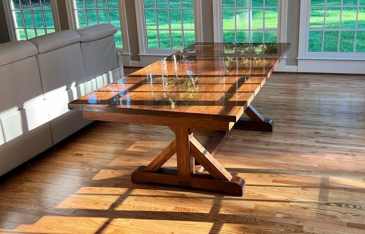 Custom glass-top trestle dining table