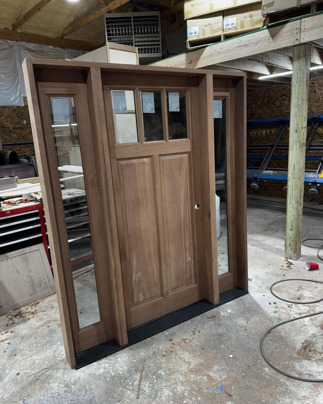 Custom mahogany entry door with matching sidelites and divided glass