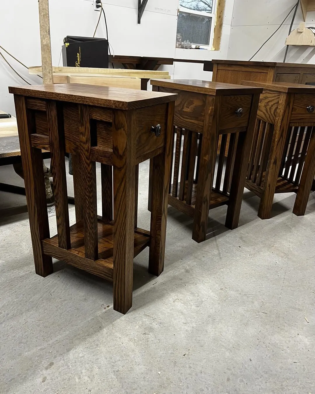 Oak mission-style end tables with drawer and slatted shelf