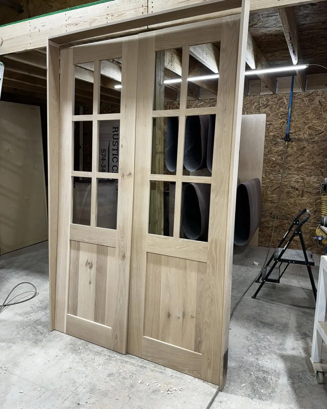 White oak double interior doors with divided glass lites, hand-built in our shop